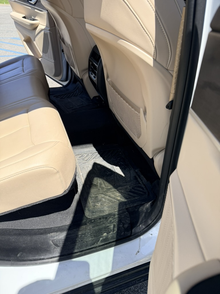 Dirty rear floor before interior detailing in North Ridgeville Ohio